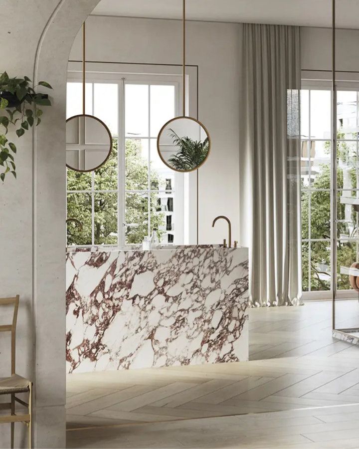 Bathroom with a vanity and shower walls in large white slabs with violet veins