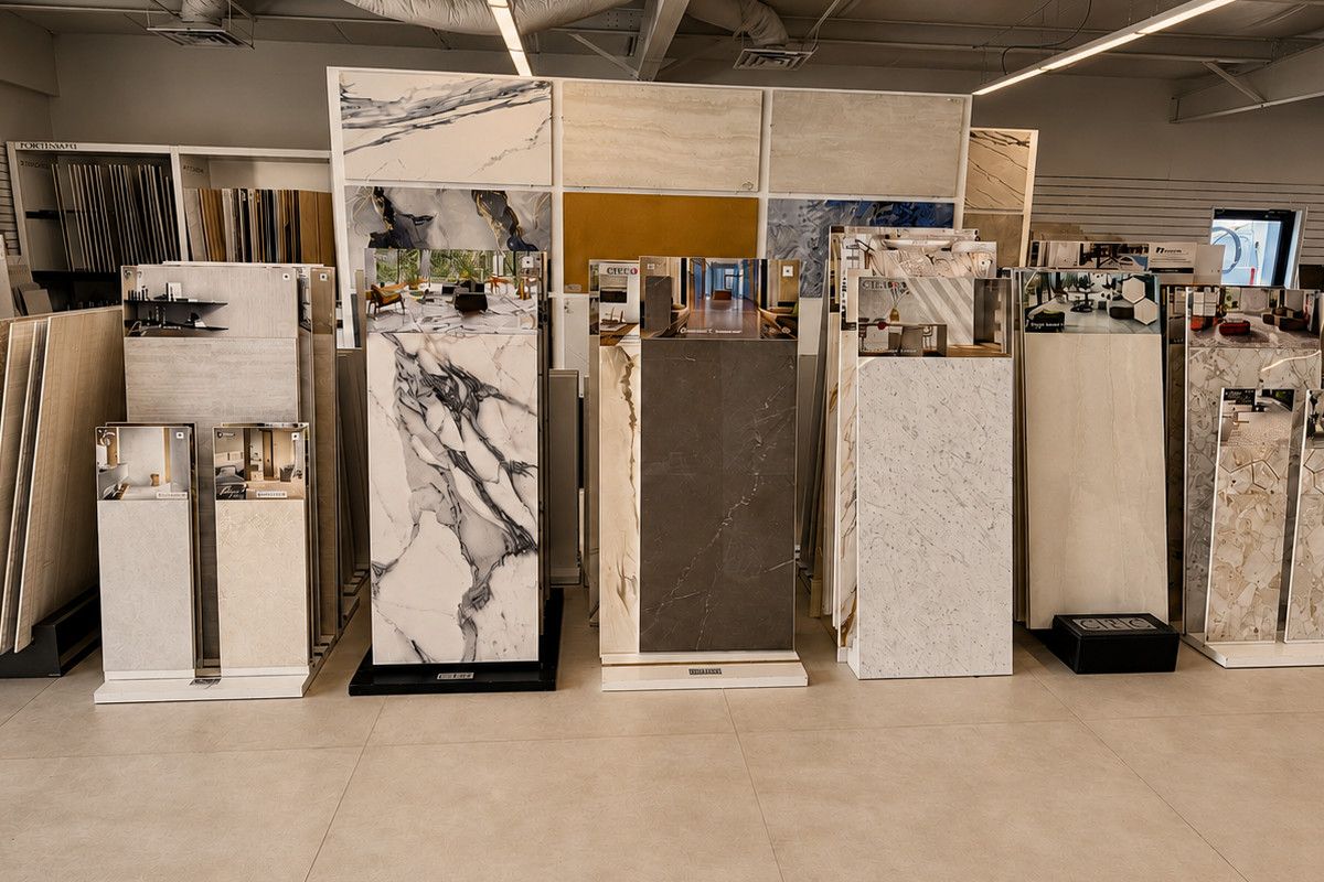 Large-format porcelain slabs on display stands in our Sarasota showroom