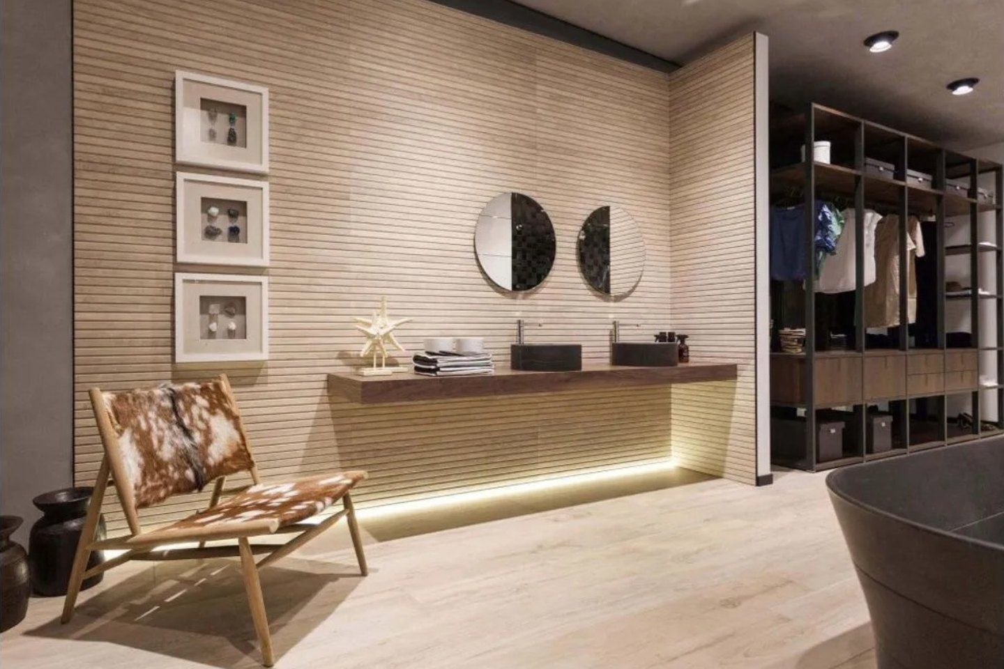 Bathroom with a ribbed wood-look wall above a long floating vanity
